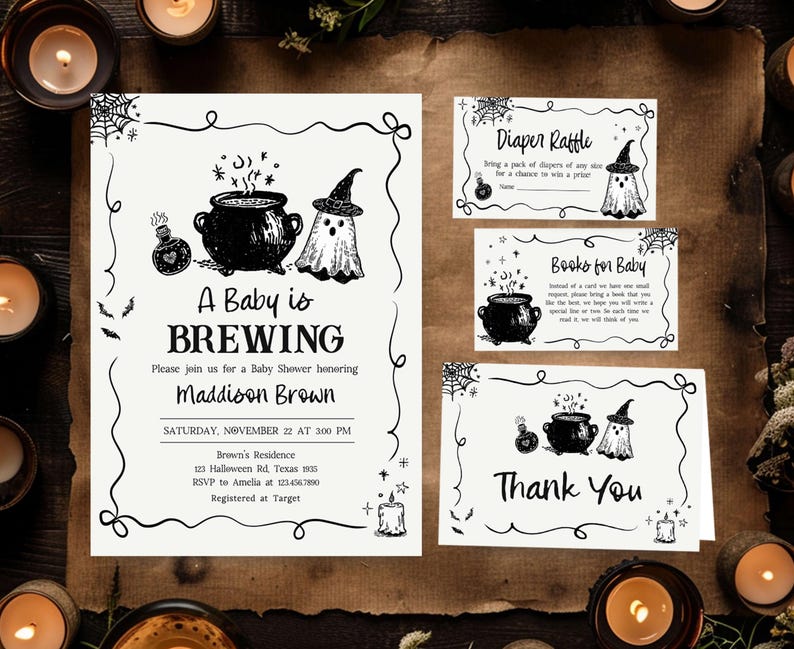 a Halloween-themed baby shower invitation and thank you cards. The invitation features illustrations of a baby, a witch, and a cauldron, along with the text "A Baby is BREWING" and "Maddison Brown". The thank you cards also have illustrations of a baby, a witch, and a cauldron, along with the text "Thank You". The background includes candles and a brown paper surface.