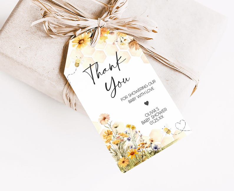 a gift wrapped in brown paper with a tag that says thank you