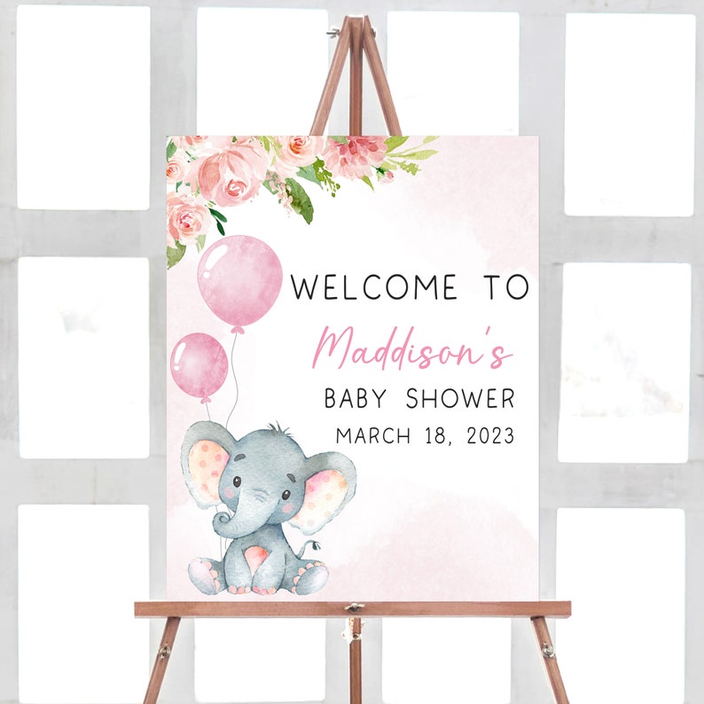 May include: Pink and white baby shower welcome sign with a watercolor floral design, a gray elephant holding pink balloons, and the text "Welcome to Madison's Baby Shower March 18, 2023".
