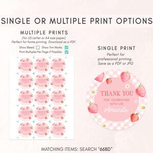 a pink and white sticker with strawberrys on it
