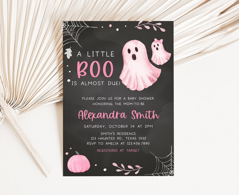 May include: A Halloween-themed baby shower invitation with a black chalkboard background. The text reads "A Little Boo is Almost Due!" in pink. Features pink watercolor ghosts, a pumpkin, and spiderwebs.