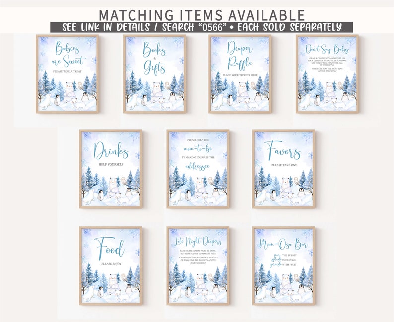 May include: A collection of framed signs with a winter theme, featuring polar bears, penguins, and snowy trees. The signs have text such as "Babies are Sweet," "Books & Gifts," and "Diaper Raffle." The signs are in a light blue and white color scheme.