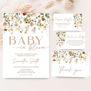 May include: A floral baby shower invitation with the text "Baby in Bloom" and the name "Samantha Smith". The invitation includes the date, time, and location of the shower, as well as the RSVP information. The invitation is decorated with a floral border.
