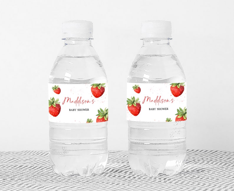 two bottles of water with strawberries on them