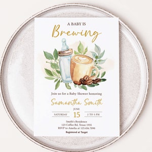 May include: A baby shower invitation with a watercolor illustration of a baby bottle and a cup of coffee with a heart design. The text "A Baby Is Brewing" is in gold lettering. The invitation is for Samantha Smith and includes the date, time, and location of the shower.
