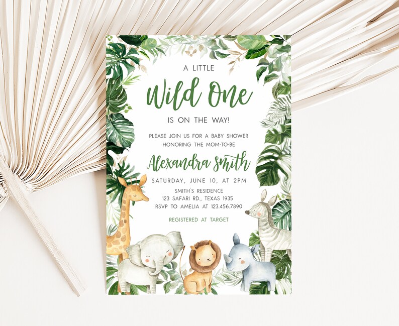 May include: A baby shower invitation with a jungle theme. The invitation features a green and white background with a variety of jungle animals, including a giraffe, elephant, lion, rhino, and zebra. The text on the invitation reads "A Little Wild One is on the Way!" and includes the name "Alexandra Smith", the date and time of the shower, the location, and the RSVP information. The invitation also includes the text "Registered at Target".