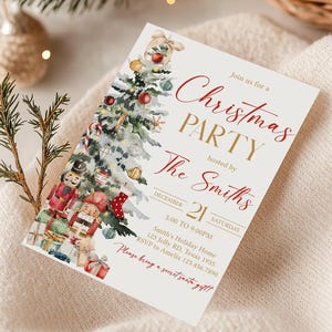 a christmas party card sitting on top of a blanket