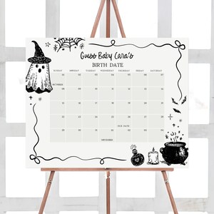a calendar with Halloween-themed illustrations, including a ghost, a witch's hat, a cauldron, and bats. The calendar displays the date for "Guess Baby Cara's Birthday Date" and includes the days of the week and the date of the birthday.