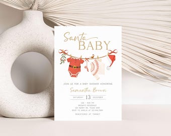 May include: A baby shower invitation with the words "Santa Baby" in gold script. The invitation features a clothesline with baby clothes and a Santa hat. The invitation includes the name Samantha Brown, date, time, and location.