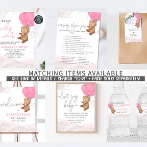 May include: A set of printable baby shower decorations featuring a cute bear holding pink balloons. The set includes a welcome sign, a don't say baby sign, a nursery rhyme game, a favor bag, and water bottle labels. The decorations are perfect for a baby shower with a pink and brown color scheme.