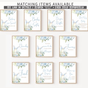 May include: Blue and white baby shower signs with a bunny rabbit illustration. The signs include text such as "Babies are Sweet", "Books & Gifts", "Diaper Raffle", "Don't Say Baby", "Drinks", "Mom-to-be Addressee", "Favors", "Food", "Late Night Diapers", and "Mimosas Bar".