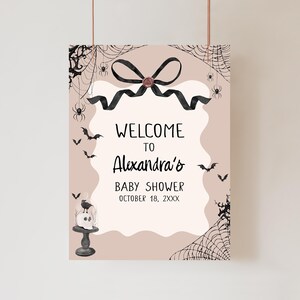 a welcome sign hanging from a hook on a wall