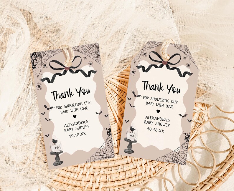 two thank you cards sitting on top of a wicker basket