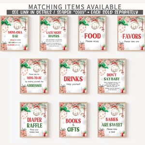 May include: A collection of framed signs with Christmas-themed decorations. Each sign has a white background with text in various fonts and colors. The signs include phrases like "Mom-osa Bar," "Late Night Diapers," and "Babies Are Sweet."