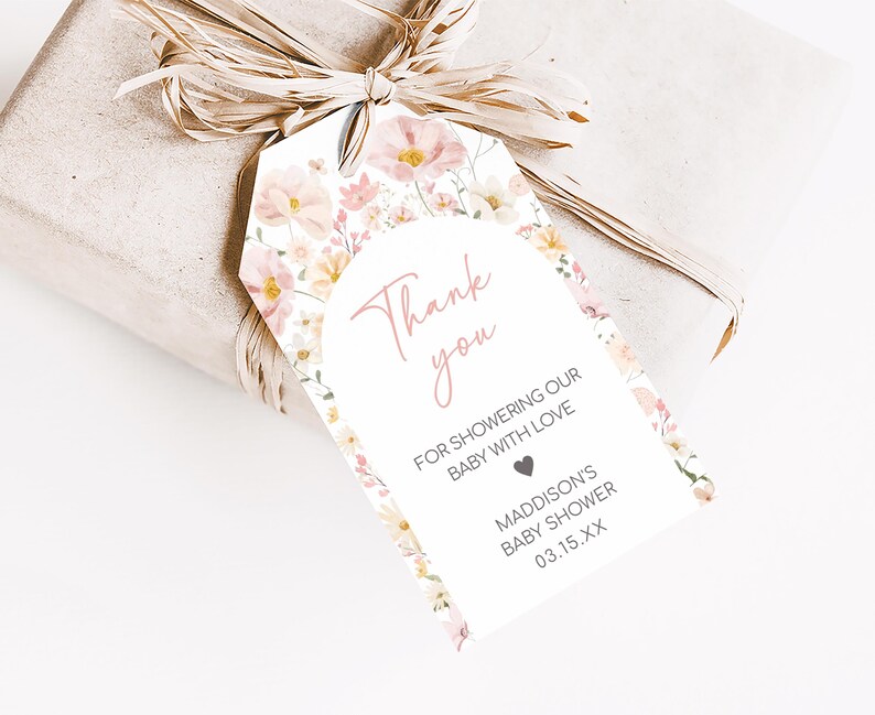 a gift wrapped in brown paper with a tag on it