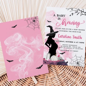 May include: Pink baby shower invitation with a witch theme. The invitation features a silhouette of a pregnant woman wearing a witch hat, bats, spiderwebs, and the text "A Baby is Brewing". The invitation is for Caroline Smith.