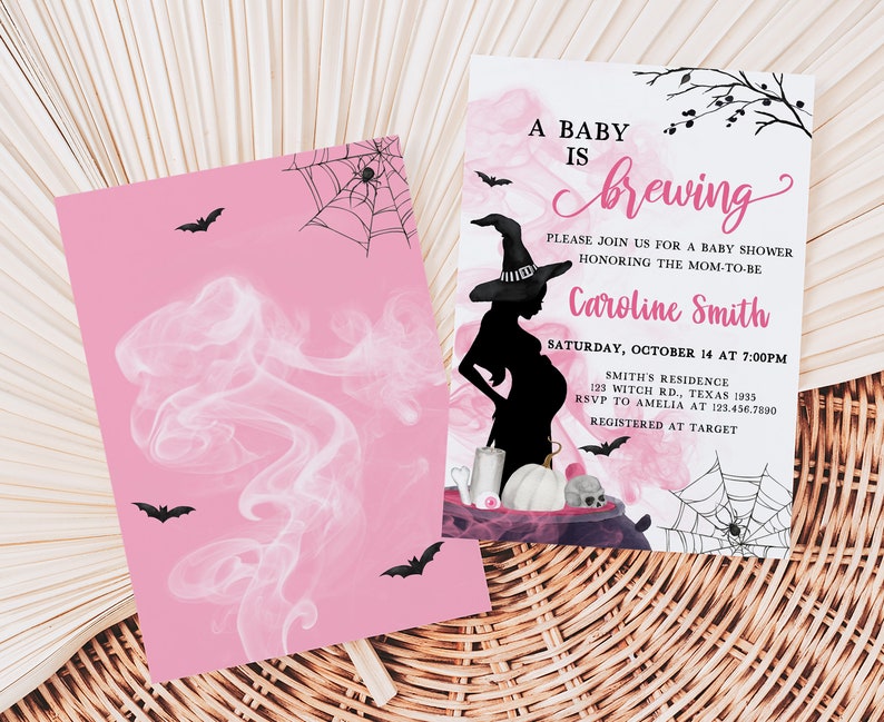 May include: Pink baby shower invitation with a witch theme. The invitation features a silhouette of a pregnant woman wearing a witch hat, bats, spiderwebs, and the text "A Baby is Brewing". The invitation is for Caroline Smith.