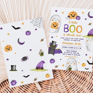 May include: Halloween-themed baby shower invitations. The invitations feature illustrations of ghosts, pumpkins, bats, and a witch's hat. The text reads "A little BOO is almost due!" and includes event details.