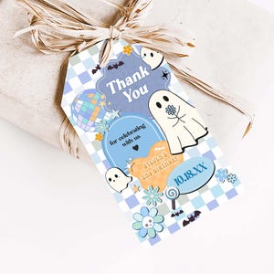 a gift wrapped in brown paper with a tag on it