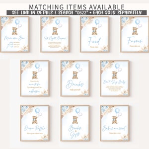 May include: Nine printable signs for a baby shower with a teddy bear theme. The signs are decorated with blue and brown colors and feature a teddy bear holding a blue balloon. The signs include titles such as "Mimosas Bar", "Let's Night Diapers", "Food", "Favors", "Drinks", "Don't Say Baby", "Diaper Raffle", "Books & Gifts", and "Babies are Sweet".