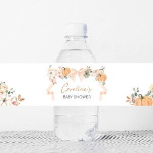 a bottle of water with a baby shower label on it