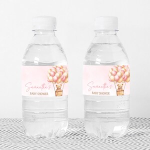 a bottle of water with a label for a baby shower