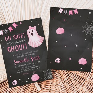 May include: Black Halloween-themed baby shower invitations. The front features a pink ghost with a bow, text that reads "Oh Sheet We're Having a Ghoul!" and event details. The back has pink pumpkins, stars, and a spiderweb design.