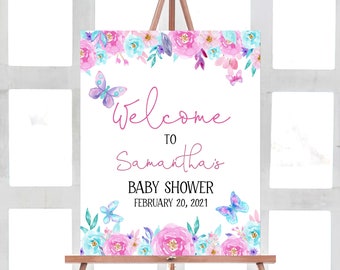 Könnte beinhalten: Willkommen zur Babyparty von Samantha Schild mit floralem Rand und Schmetterlingen. Das Schild ist weiß mit rosa und blauen Aquarellblumen und Schmetterlingen. Der Text ist in rosa und schwarz. Das Datum der Party ist der 20. Februar 2021.