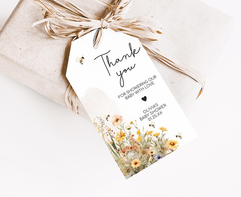 a gift wrapped in brown paper with a tag attached to it
