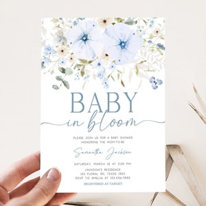a person holding up a baby in bloom card