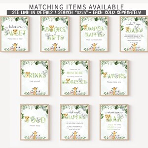 May include: A set of ten printable signs for a jungle-themed baby shower. The signs feature a variety of jungle animals, including monkeys, elephants, and giraffes. The signs are decorated with green leaves and have a watercolour effect. The signs include the following text: "Babies are Sweet", "Books & Gifts", "Diaper Raffle", "Don't Say Baby", "Drinks", "Mom-to-Be Dresser", "Favors", "Food", "Late Night Diapers", and "Mom-isa Bar".