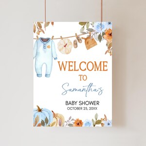 a welcome sign hanging from a clothes line