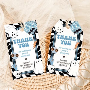 two thank you cards sitting on top of a wicker basket