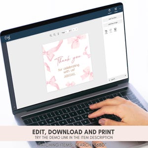 a person typing on a laptop with a thank you card on the screen