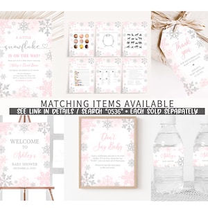 May include: A collection of baby shower decorations with a snowflake theme. Items include invitations, games, a welcome sign, water bottle labels, and a "Don't Say Baby" sign. The color scheme is pink, silver, and white.