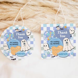 a couple of tags with ghost on them