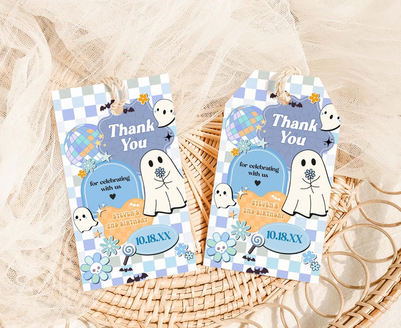 two thank you tags sitting on top of a wicker basket