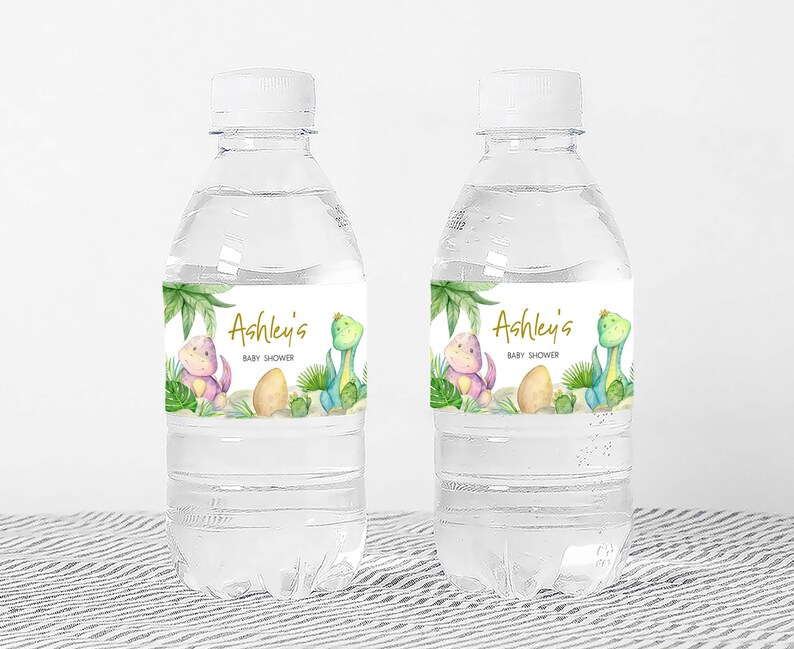 two bottles of water sitting on top of a table