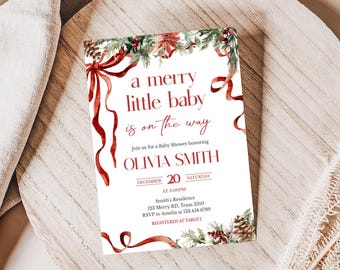 May include: A baby shower invitation with a festive design. The white card features red text and watercolour illustrations of ribbons, foliage, and berries. The text announces a baby shower for Olivia Smith, with the date, time, and RSVP details included.