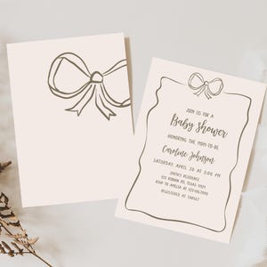 a couple of cards with a bow on them