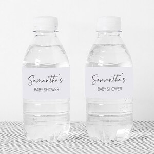 a couple of bottles of water sitting on top of a table