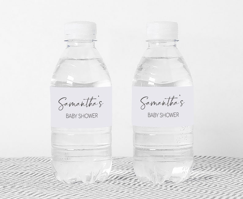 a couple of bottles of water sitting on top of a table