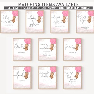 May include: Set of ten printable baby shower signs featuring a cute cartoon bear holding pink balloons. The signs include text such as "Babies are sweet", "Drinks", "Favors", "Late night diapers", and "Mimosas bar".