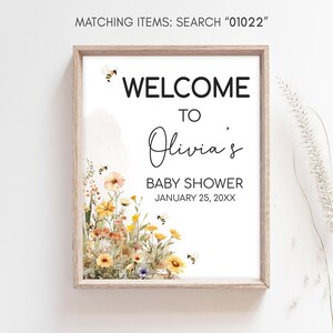 a picture of a baby shower sign hanging on a wall