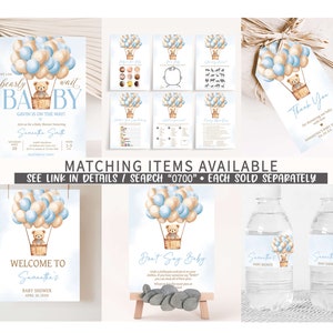 Peut inclure: Un ensemble de d&eacute;corations imprimables pour une f&ecirc;te pr&eacute;natale avec une illustration aquarelle d'un ours en peluche dans un ballon &agrave; air chaud avec des ballons bleus et beiges. Le texte "We can barely wait baby" est sur l'invitation. Le texte "Welcome to Samantha's Baby Shower" est sur le panneau de bienvenue. Le texte "Don't Say Baby" est sur la carte de jeu. Le texte "Samantha's Baby Shower" est sur les &eacute;tiquettes des bouteilles d'eau. Le texte "Thank You" est sur l'&eacute;tiquette de faveur.