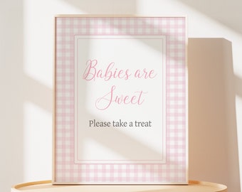 May include: A framed sign with a pink and white gingham border. The sign reads "Babies are Sweet, Please take a treat" in pink script. The text "MATCHING ITEMS: SEARCH "0777"" is at the top.