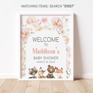 a picture of a baby shower sign on a wall