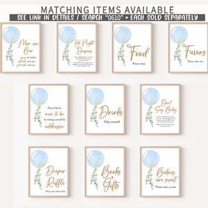 May include: Blue and gold baby shower signs with balloon and eucalyptus illustrations. Signs include "Late Night Diapers", "Food", "Favors", "Drinks", "Don't Say Baby", "Diaper Raffle", "Books & Gifts", "Babies are Sweet", and "Men-osa Bar".