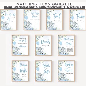 a set of nine blue and white baby shower items