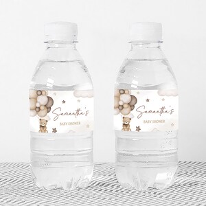 a bottle of water with a teddy bear on it
